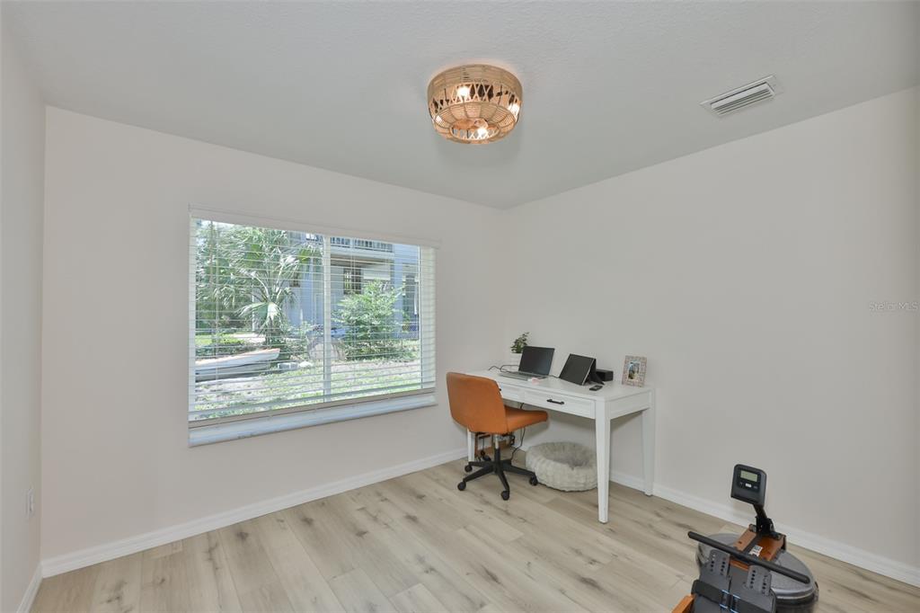 1578 Indian Bay Road Spring Hill, FL 34607 - Photo 23 of 51 a workspace with furniture hardwood and a window