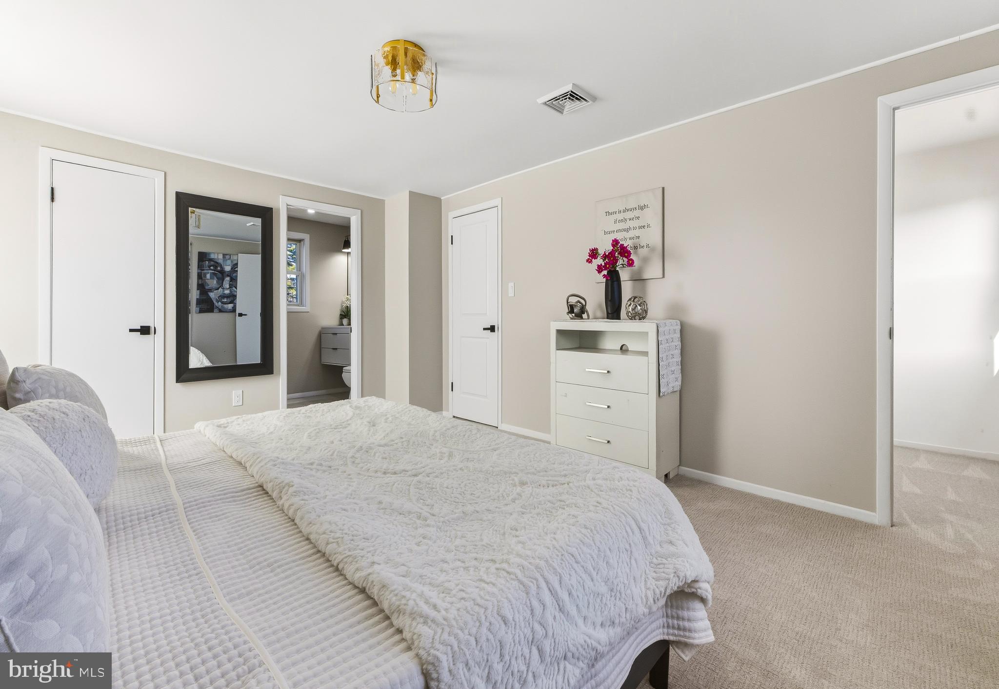 53 Spindletop Lane Willingboro, NJ 08046 - Photo 14 of 22 a spacious bedroom with a bed and a chandelier