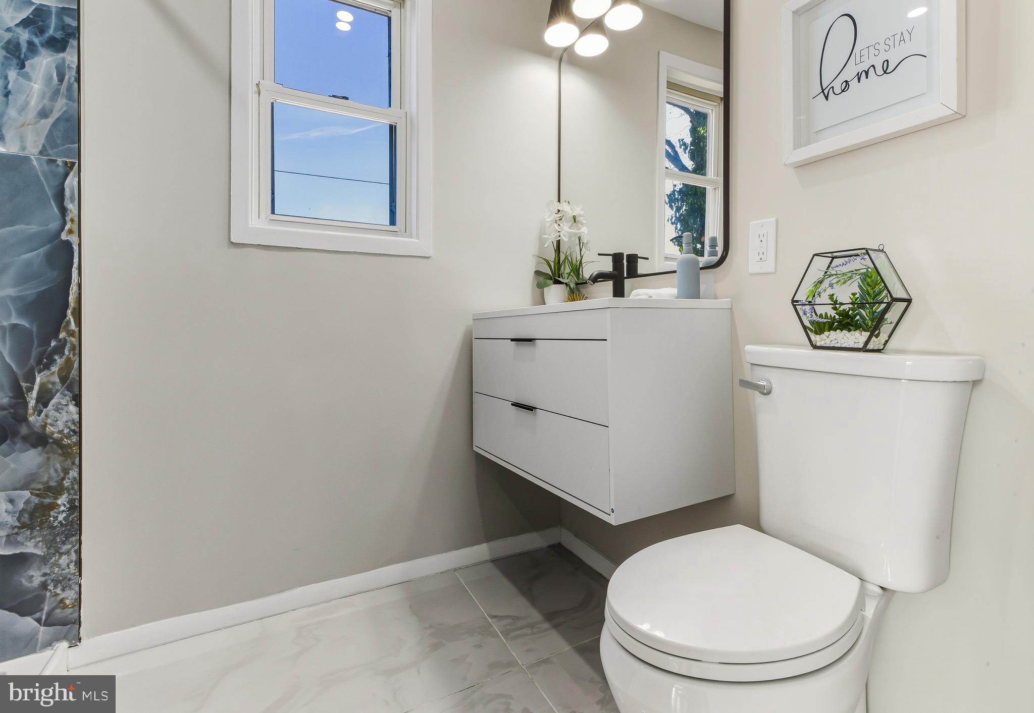 53 Spindletop Lane Willingboro, NJ 08046 - Photo 18 of 22 a white toilet sitting next to a bathroom sink