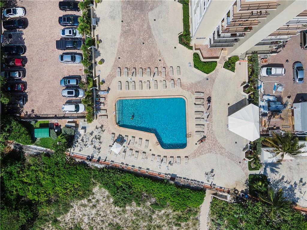 1900 South Ocean Boulevard, Unit 4H Pompano Beach, FL 33062 - Photo 29 of 35 an aerial view of a house with a garden and parking