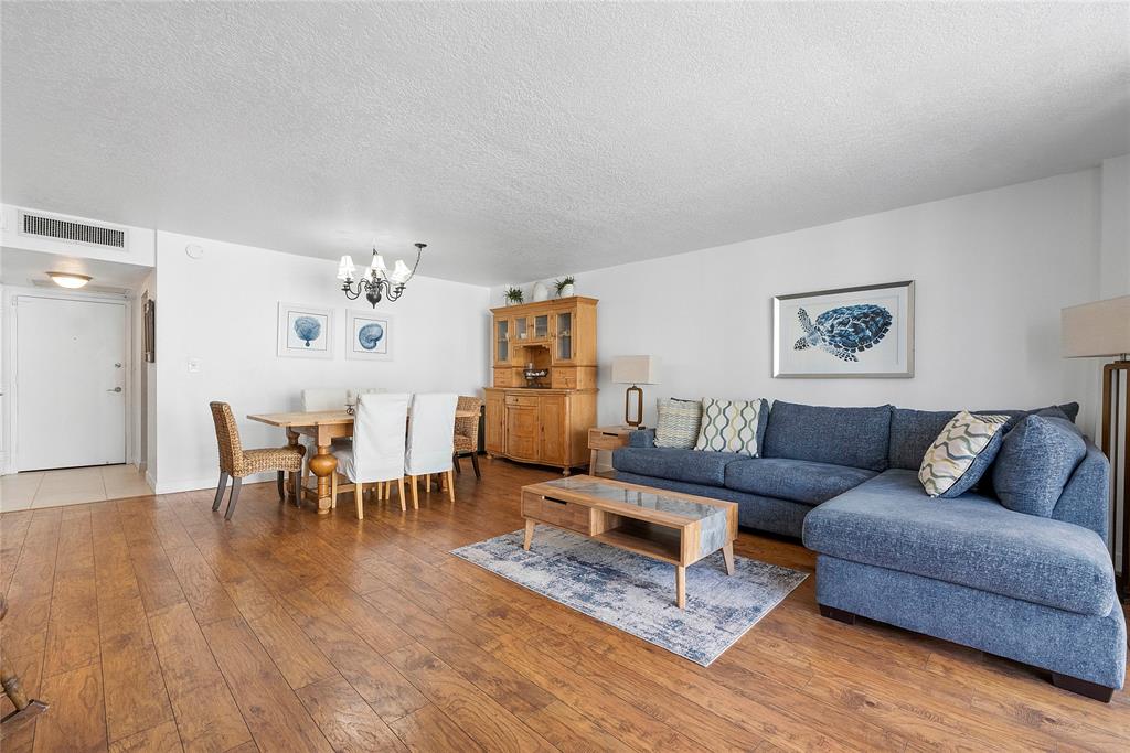 1900 South Ocean Boulevard, Unit 4H Pompano Beach, FL 33062 - Photo 7 of 35 a living room with furniture and wooden floor