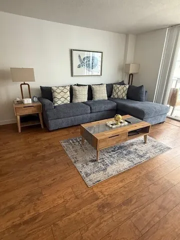 a living room with furniture and a rug