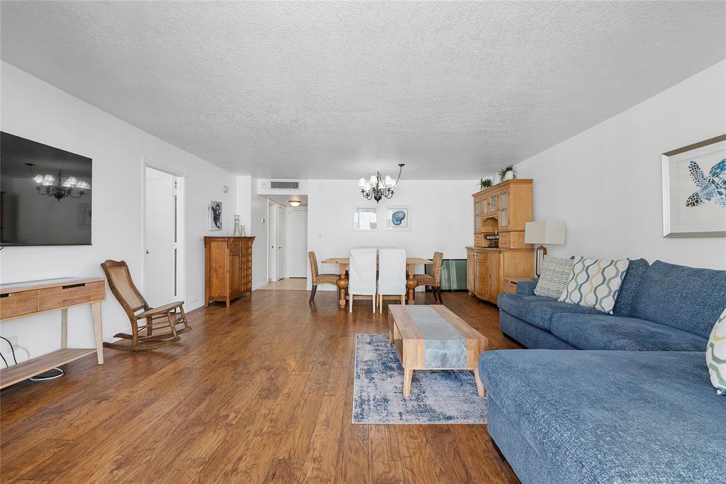 1900 South Ocean Boulevard, Unit 4H Pompano Beach, FL 33062 - Photo 9 of 35 a living room with furniture and a wooden floor