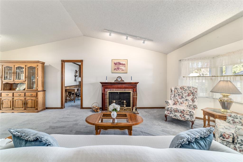 8530 Southwest 92 Street, Unit D Ocala, FL 34481 - Photo 16 of 42 a living room with furniture and a fireplace