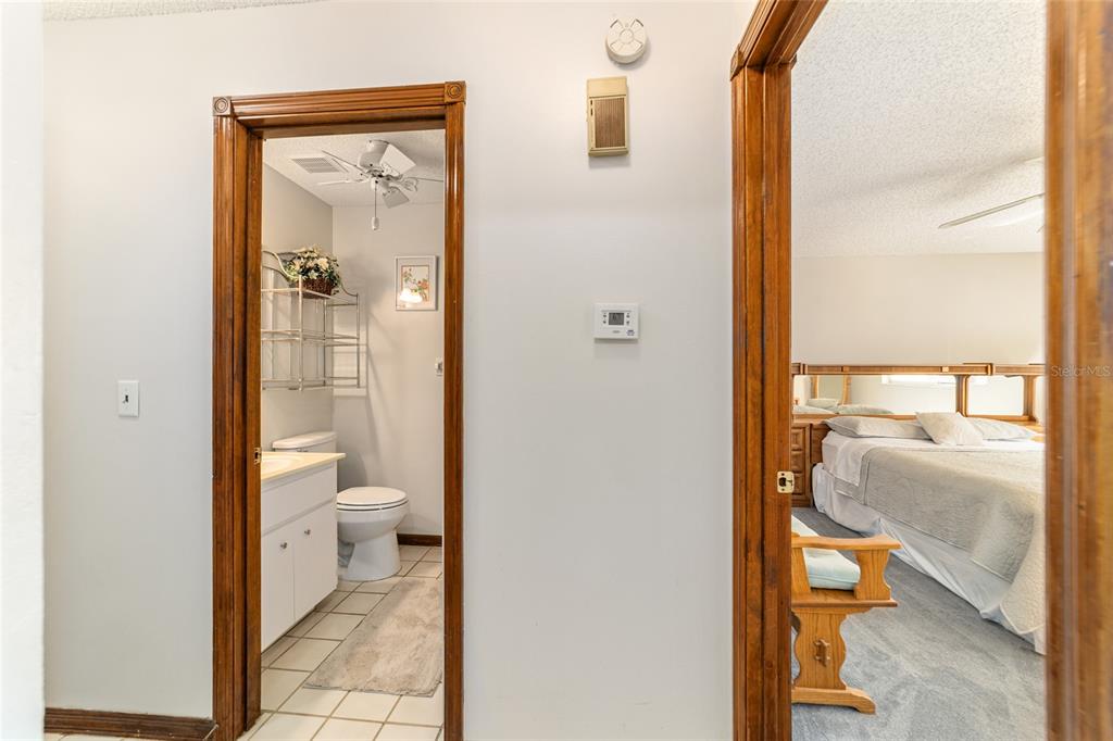 8530 Southwest 92 Street, Unit D Ocala, FL 34481 - Photo 21 of 42 a bathroom with a granite countertop toilet and a sink