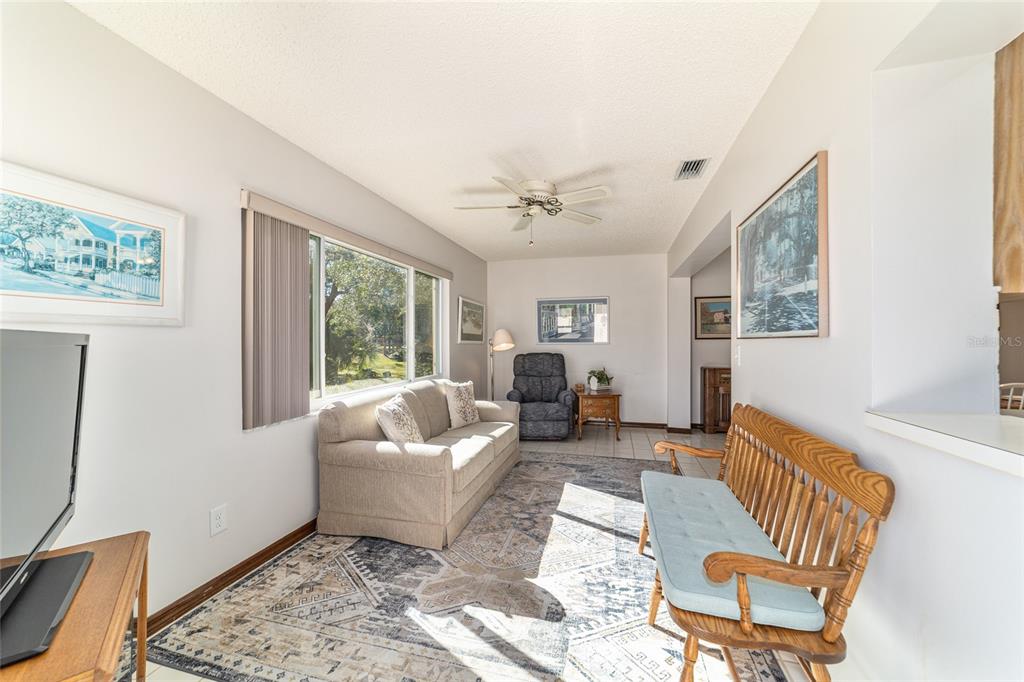 8530 Southwest 92 Street, Unit D Ocala, FL 34481 - Photo 25 of 42 a living room with furniture and a window