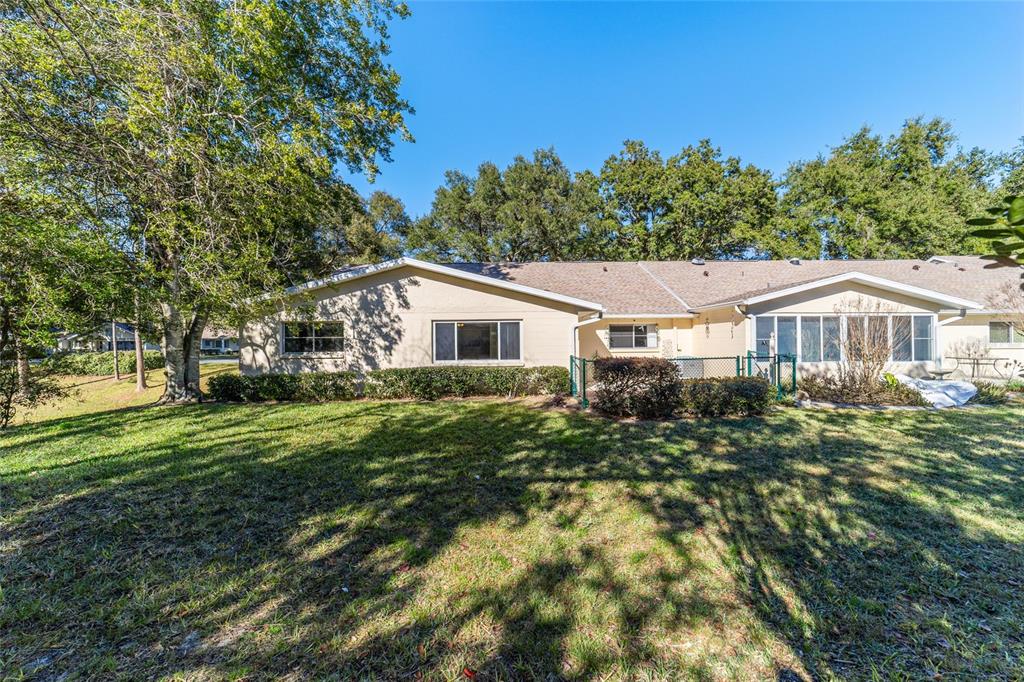 8530 Southwest 92 Street, Unit D Ocala, FL 34481 - Photo 28 of 42 a aerial view of a house with a yard
