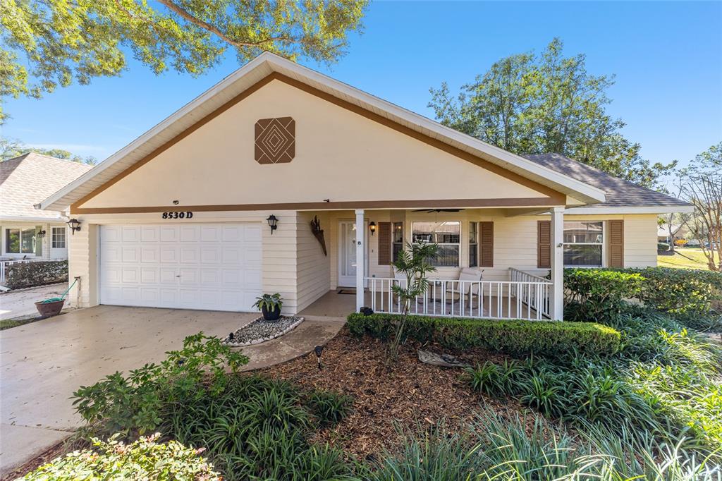 8530 Southwest 92 Street, Unit D Ocala, FL 34481 - Photo 29 of 42 a front view of a house with garden