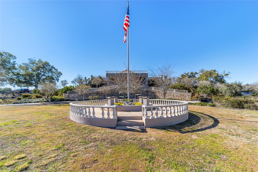 8530 Southwest 92 Street, Unit D Ocala, FL 34481 - Photo 41 of 42 a view of a swimming pool with a bench and chair