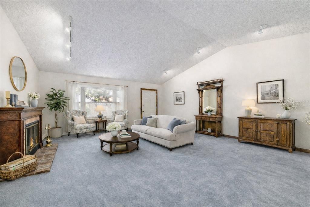 8530 Southwest 92 Street, Unit D Ocala, FL 34481 - Photo 5 of 42 a living room with furniture and a fireplace