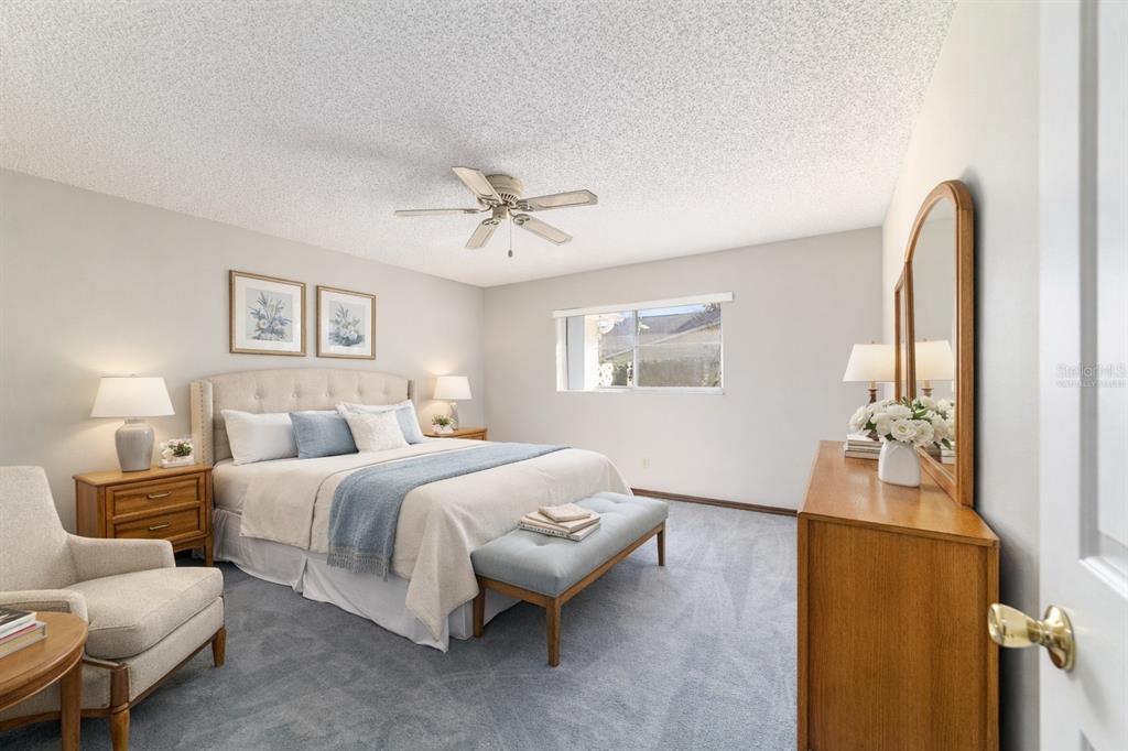 8530 Southwest 92 Street, Unit D Ocala, FL 34481 - Photo 8 of 42 a spacious bedroom with a bed and furniture