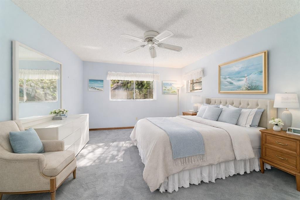 8530 Southwest 92 Street, Unit D Ocala, FL 34481 - Photo 9 of 42 a spacious bedroom with a bed and couch