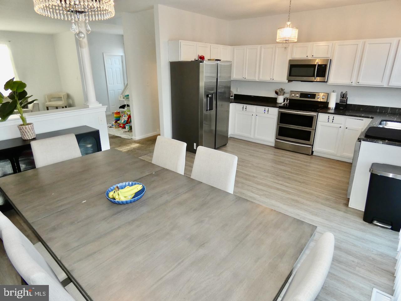 15 Wicklow Road Bear, DE 19701 - Photo 15 of 53 a kitchen with stainless steel appliances a refrigerator a stove a microwave a sink and a center island