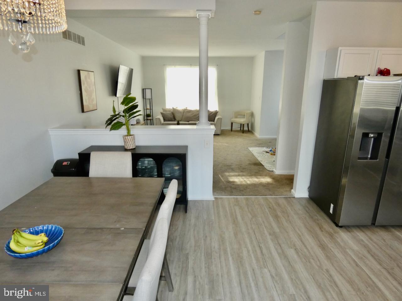 15 Wicklow Road Bear, DE 19701 - Photo 16 of 53 a living room with stainless steel appliances furniture a rug and a view of kitchen