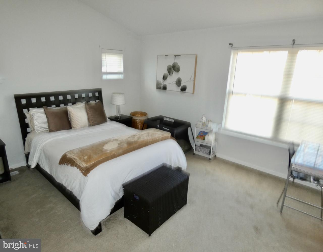 15 Wicklow Road Bear, DE 19701 - Photo 24 of 53 a bed sitting in a bedroom next to a window