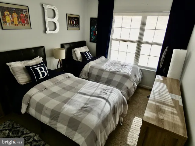 a bedroom with bed and a window