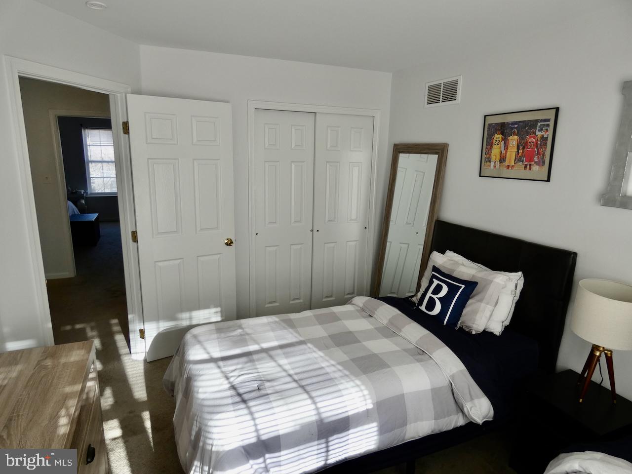 15 Wicklow Road Bear, DE 19701 - Photo 34 of 53 a bedroom with a bed and a dresser