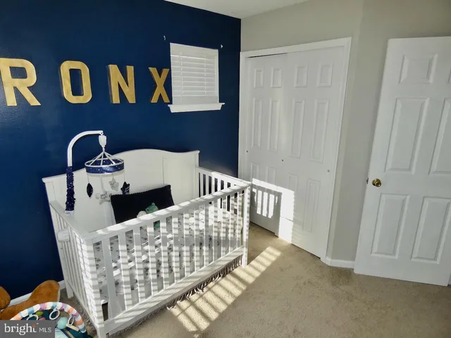 a view of a room that has a table and chair
