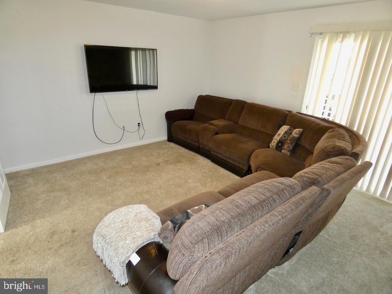 15 Wicklow Road Bear, DE 19701 - Photo 42 of 53 a living room with couches and a flat screen tv