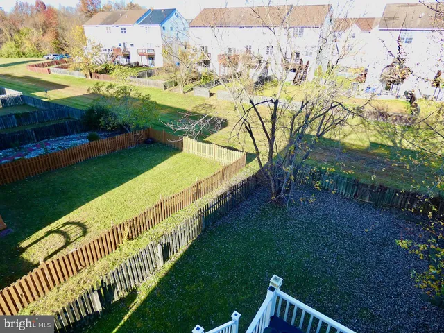 a view of a yard with table and chairs