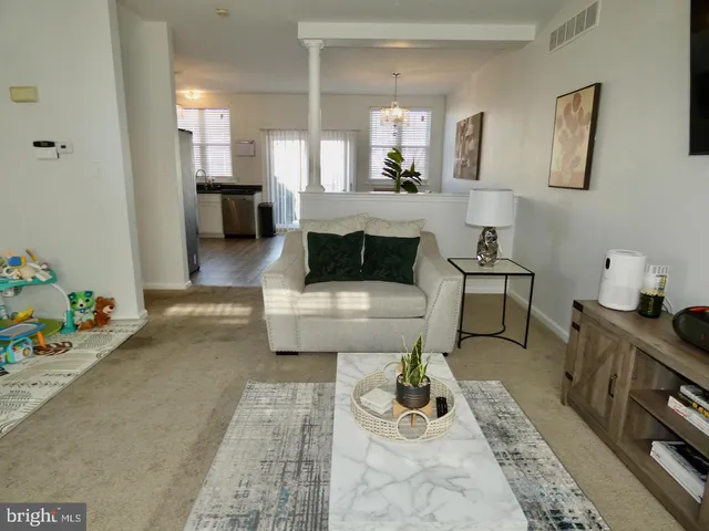 a living room with furniture and a couch