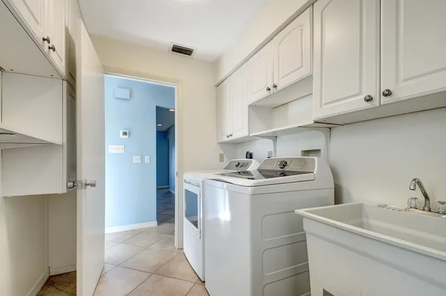 a view of a park with iron fence