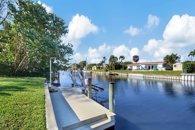 a view of a swimming pool with a yard