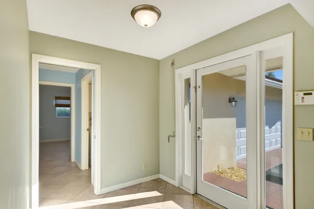 a view of a bathroom with a glass door and a glass door