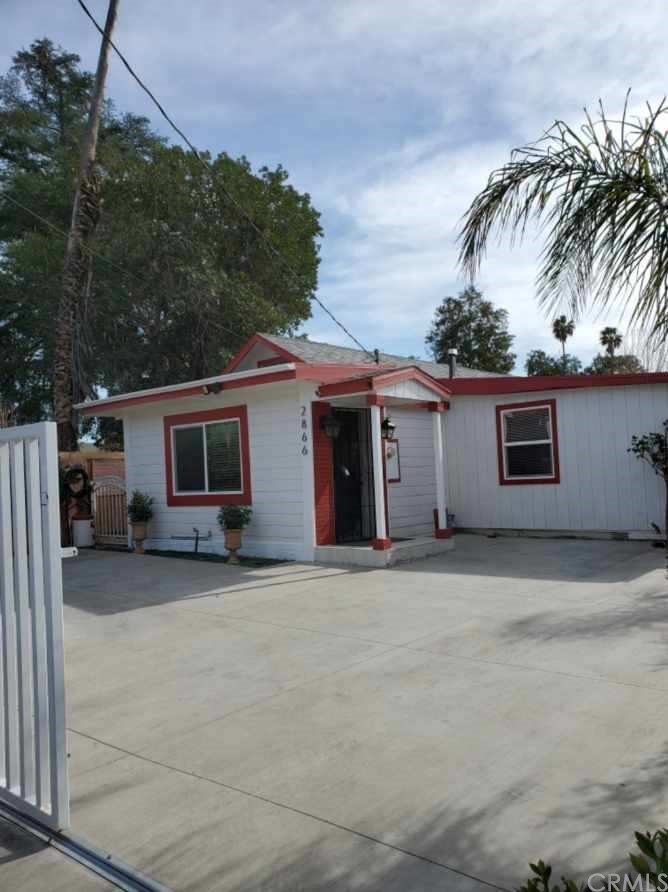 2866 Iris Street Riverside, CA 92507 - Photo 1 of 1 a front view of a house with a garage
