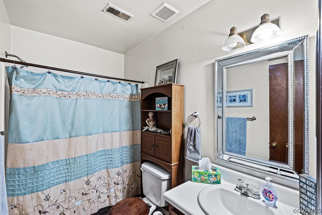 7830 Brightridge Road Chesterfield, VA 23832 - Photo 12 of 18 a bathroom with a sink toilet and shower