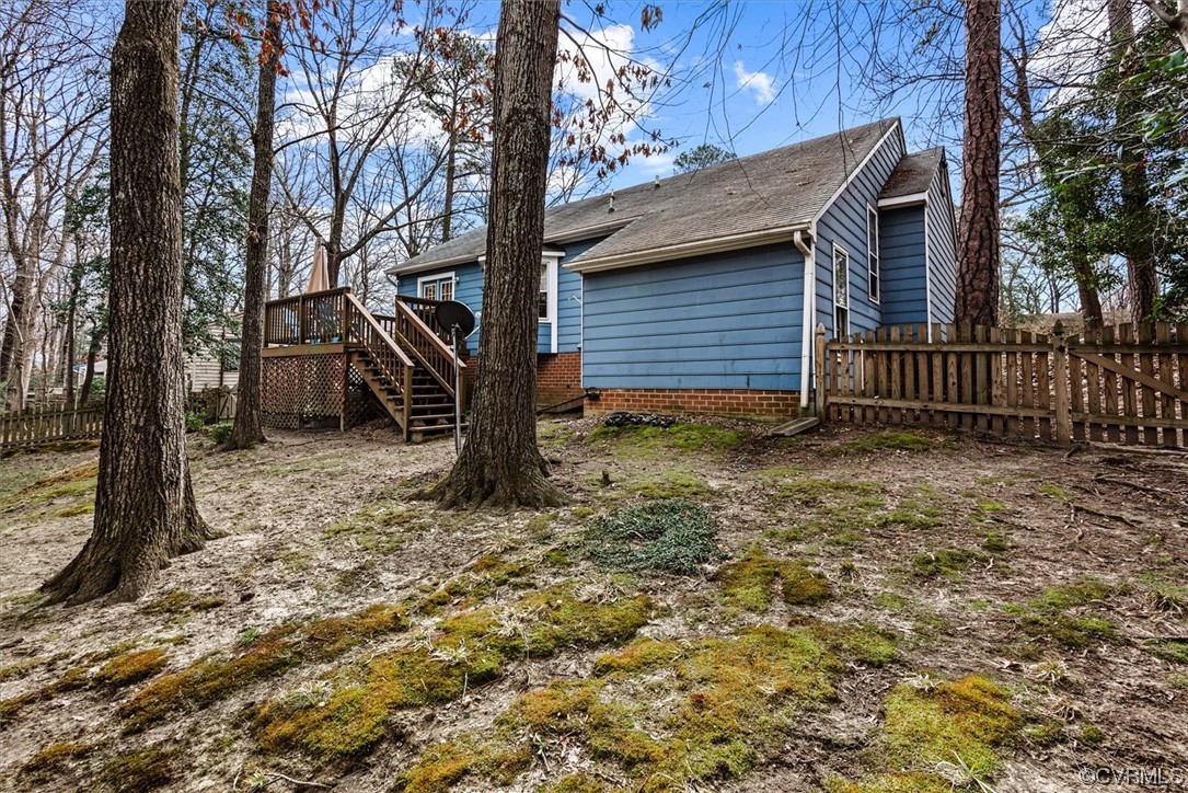 7830 Brightridge Road Chesterfield, VA 23832 - Photo 16 of 18 a backyard of a house with lots of plants and trees