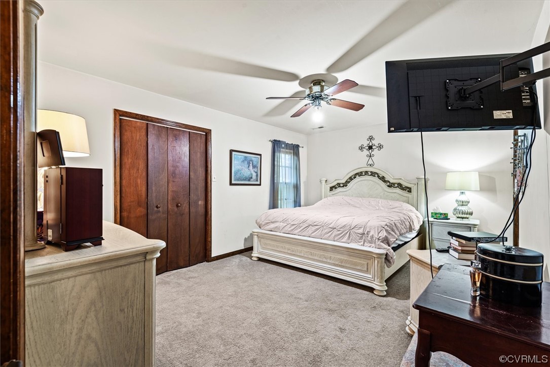7830 Brightridge Road Chesterfield, VA 23832 - Photo 9 of 18 a bedroom with a bed and a chandelier