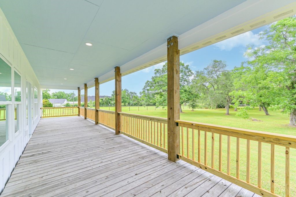 4294 Brazos River Road, Unit CR400 Freeport, TX 77541 - Photo 13 of 50 a view of balcony with wooden floor