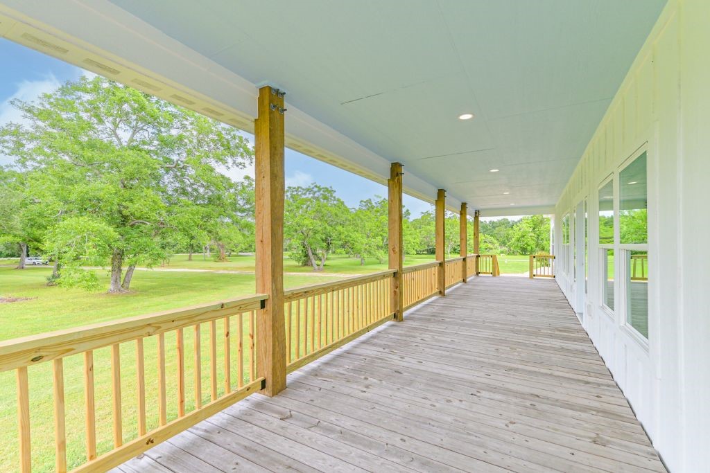 4294 Brazos River Road, Unit CR400 Freeport, TX 77541 - Photo 14 of 50 a view of a room with large windows and a table