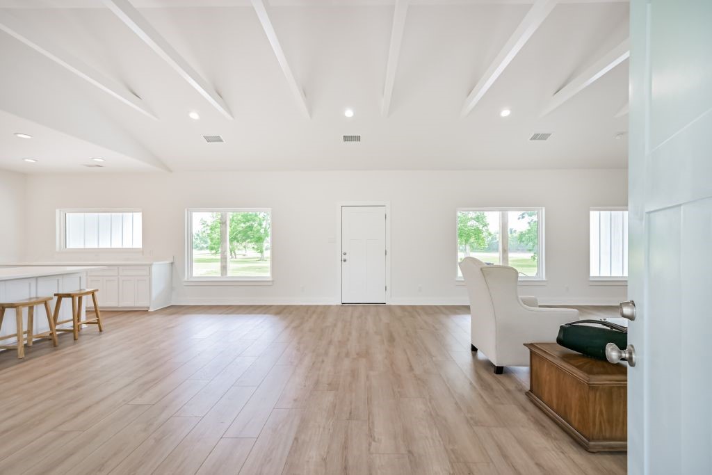 4294 Brazos River Road, Unit CR400 Freeport, TX 77541 - Photo 16 of 50 a view of empty room with wooden floor and fan