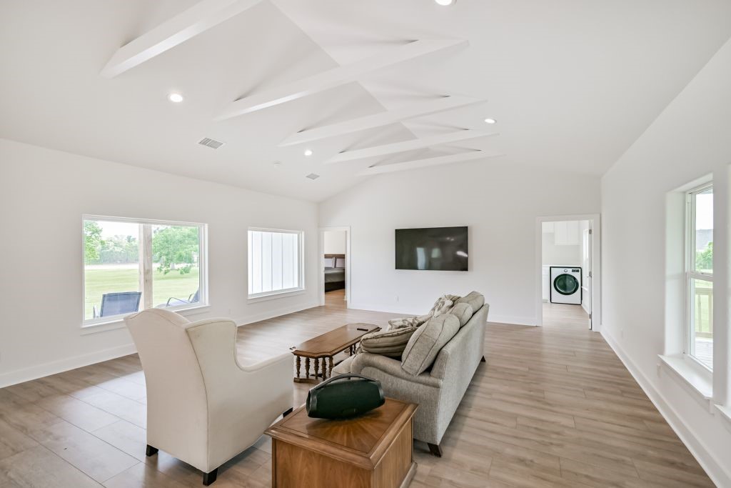 4294 Brazos River Road, Unit CR400 Freeport, TX 77541 - Photo 17 of 50 a living room with furniture a flat screen tv and a large window