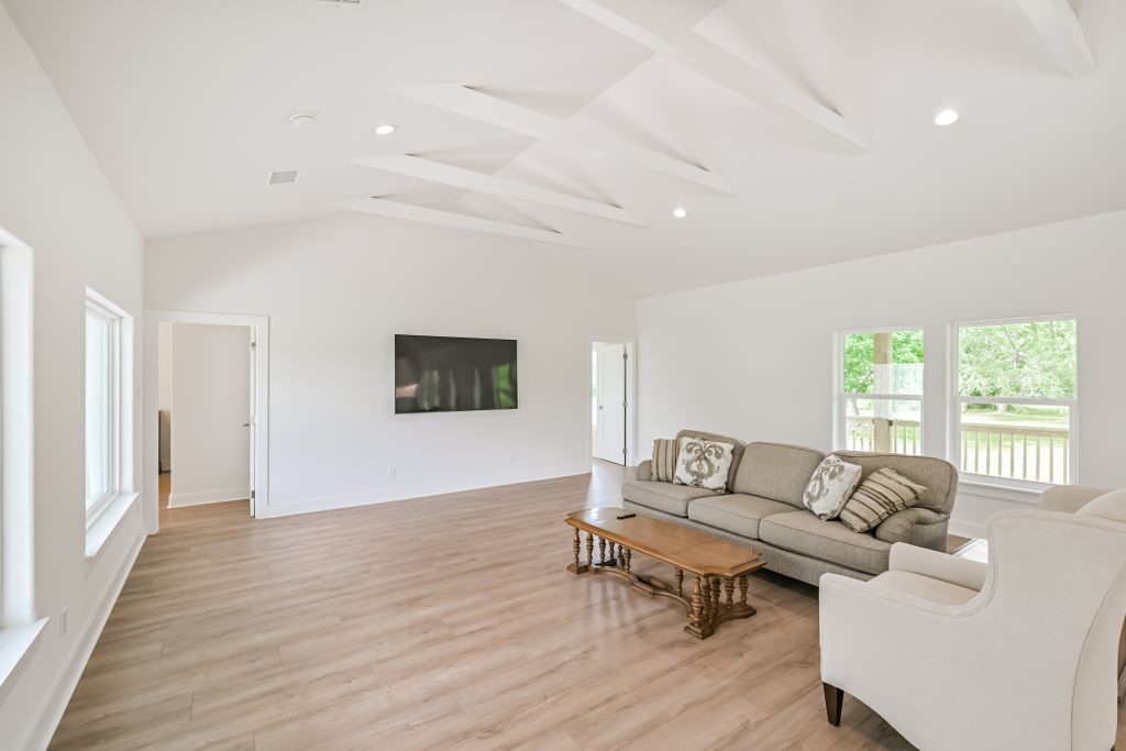 4294 Brazos River Road, Unit CR400 Freeport, TX 77541 - Photo 18 of 50 a living room with furniture and a wooden floor