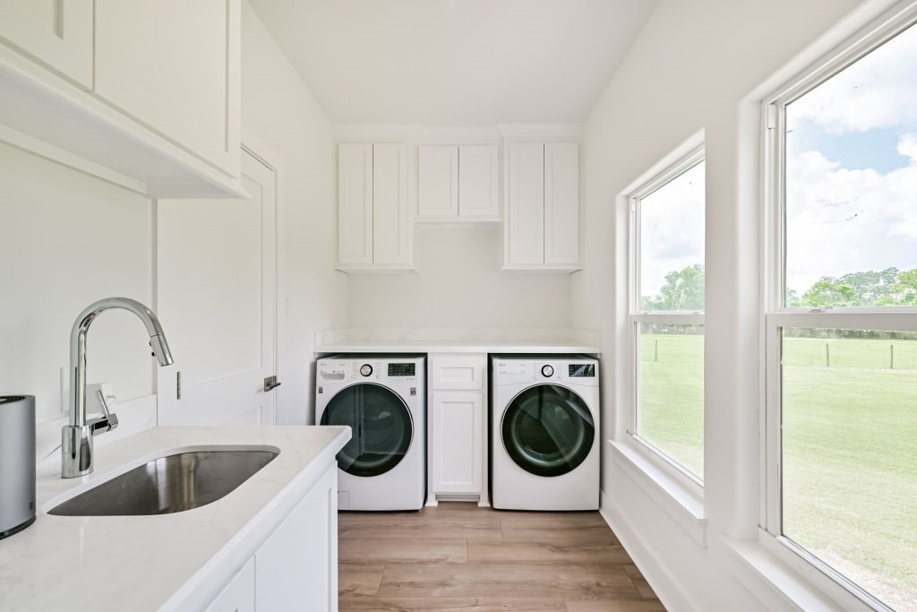 4294 Brazos River Road, Unit CR400 Freeport, TX 77541 - Photo 22 of 50 a view of living room with washer and dryer