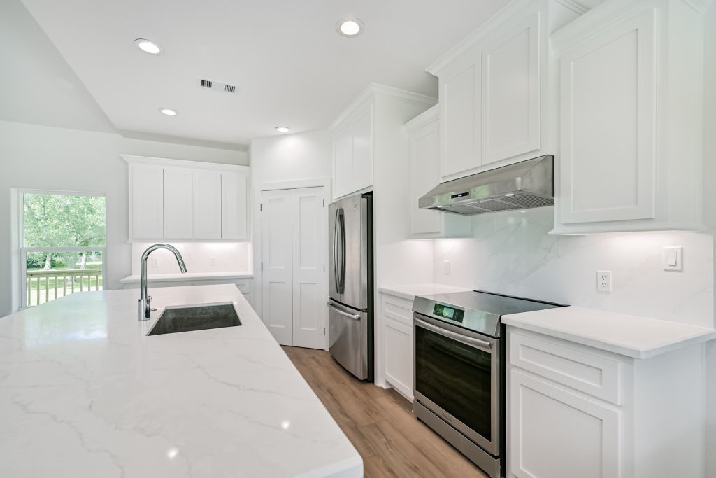 4294 Brazos River Road, Unit CR400 Freeport, TX 77541 - Photo 27 of 50 a kitchen with a sink stainless steel appliances and cabinets
