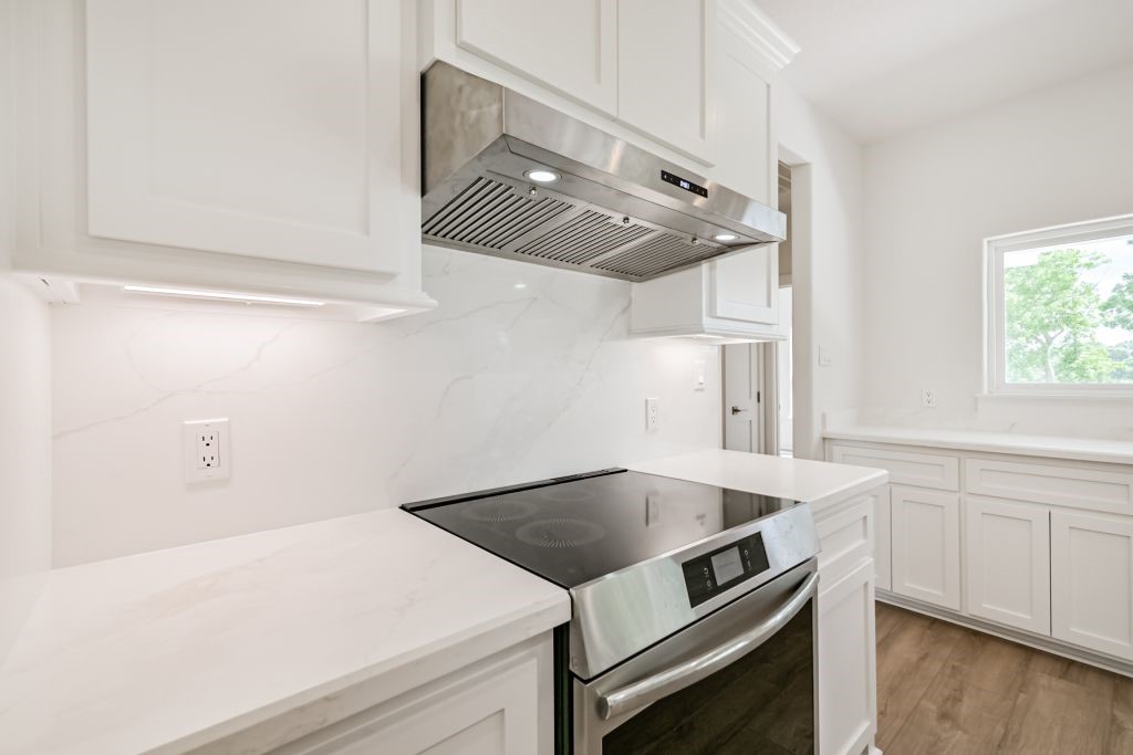 4294 Brazos River Road, Unit CR400 Freeport, TX 77541 - Photo 28 of 50 a kitchen that has a sink and a stove
