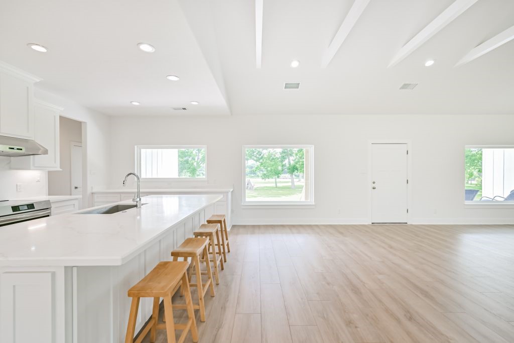 4294 Brazos River Road, Unit CR400 Freeport, TX 77541 - Photo 31 of 50 a kitchen with stainless steel appliances granite countertop a sink a stove and a wooden floors