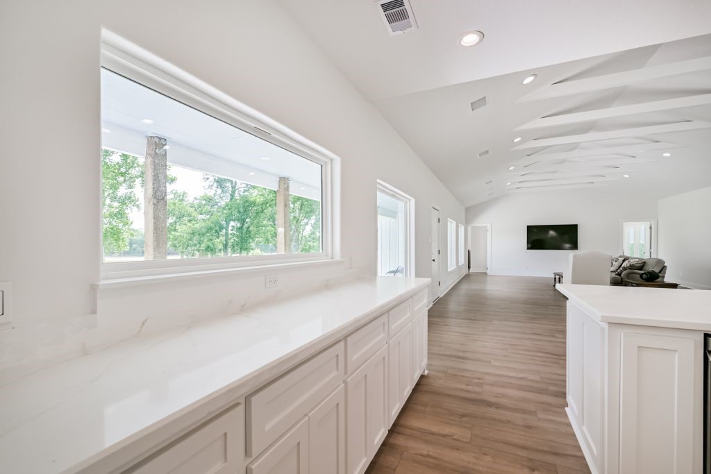 4294 Brazos River Road, Unit CR400 Freeport, TX 77541 - Photo 32 of 50 a living room with stainless steel appliances furniture a large window and wooden floor