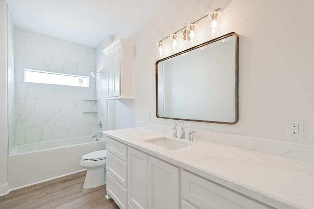 4294 Brazos River Road, Unit CR400 Freeport, TX 77541 - Photo 35 of 50 a bathroom with a sink a toilet and shower