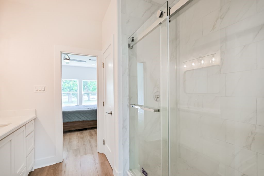 4294 Brazos River Road, Unit CR400 Freeport, TX 77541 - Photo 43 of 50 a bathroom with a sink and a shower