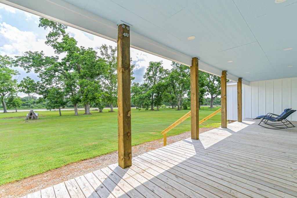 4294 Brazos River Road, Unit CR400 Freeport, TX 77541 - Photo 46 of 50 a view of a room with wooden floor and a yard
