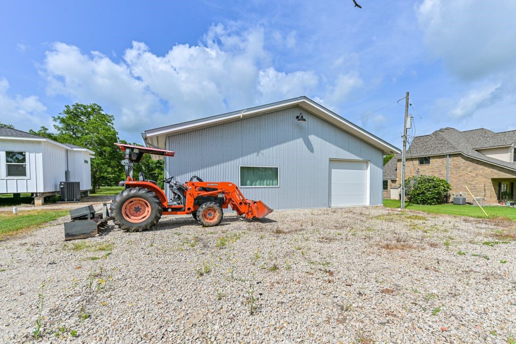 4294 Brazos River Road, Unit CR400 Freeport, TX 77541 - Photo 6 of 50 a view of a house with a yard