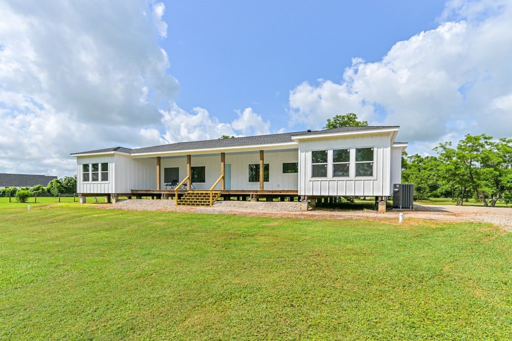 4294 Brazos River Road, Unit CR400 Freeport, TX 77541 - Photo 7 of 50 a front view of house with yard barbeque and outdoor seating