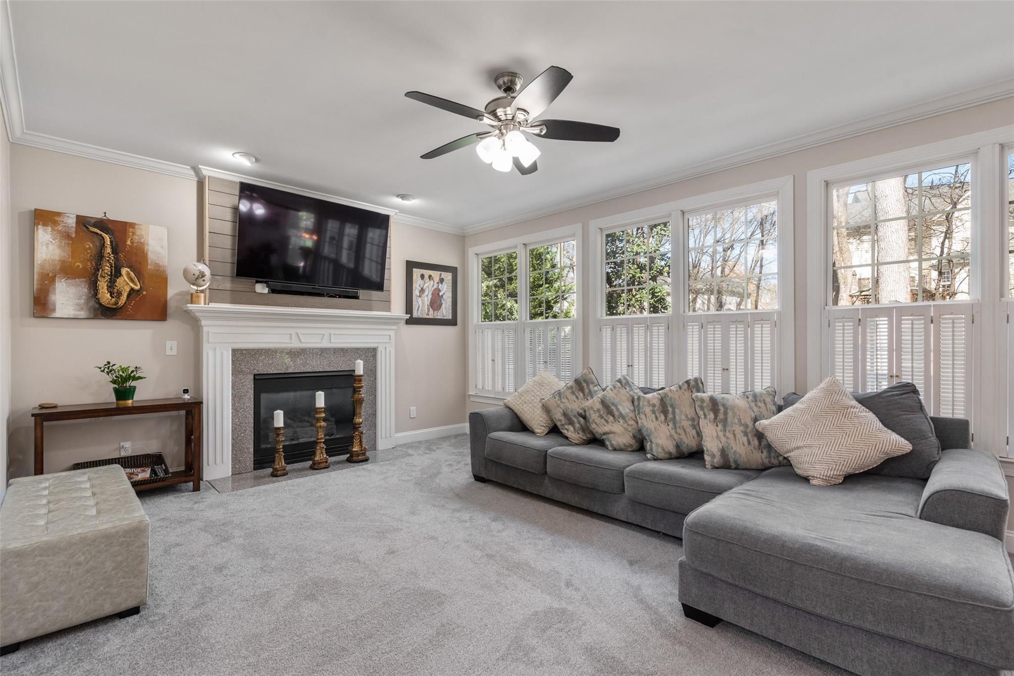 3519 Rhett Butler Place Charlotte, NC 28270 - Photo 12 of 38 a living room with furniture a flat screen tv and a fireplace