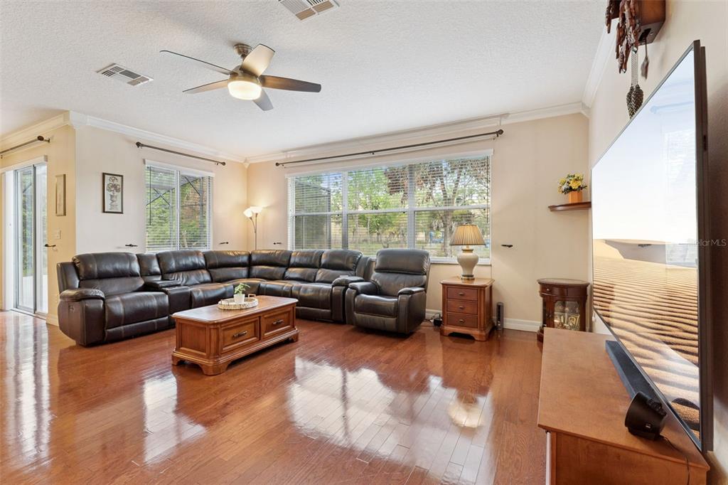 14790 Tullamore Loop Winter Garden, FL 34787 - Photo 11 of 42 a living room with furniture and a large window