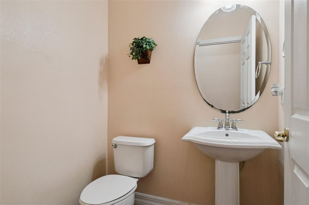 14790 Tullamore Loop Winter Garden, FL 34787 - Photo 16 of 42 a bathroom with a sink toilet and mirror